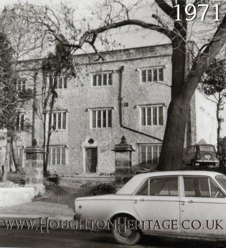 A car passes the front of Houghton Hall in 1971