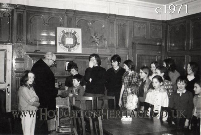 Mr John Edwards, Chairman of Houghton YMCA, giving out prizes and awards in the Boardroom at Houghton Hall, circa 1971