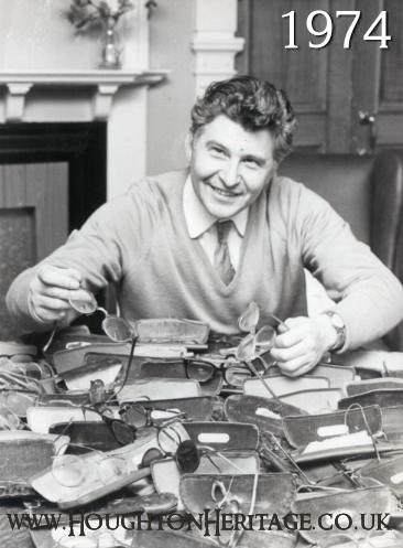 Rowland Storey, General Secretary, in the board room of the YMCA in Houghton Hall, 1974.  Rowland became known as the 'spectacle man' as he used to collect old specs for a charity that used the frames in Africa