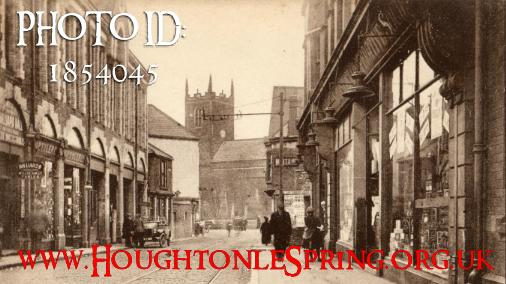On Newbottle Street, looking towards St Michael's Church.  Note the buildings on the left which were the old Town Hall and Covered Market.  Tramlines help to date this photo to 1905-1925.