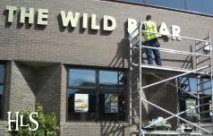 The new signs go up on the Wild Boar, Frederick Place